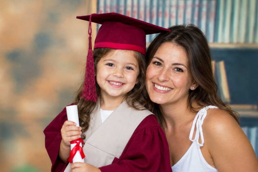Preschool graduation portrait in cap and gown